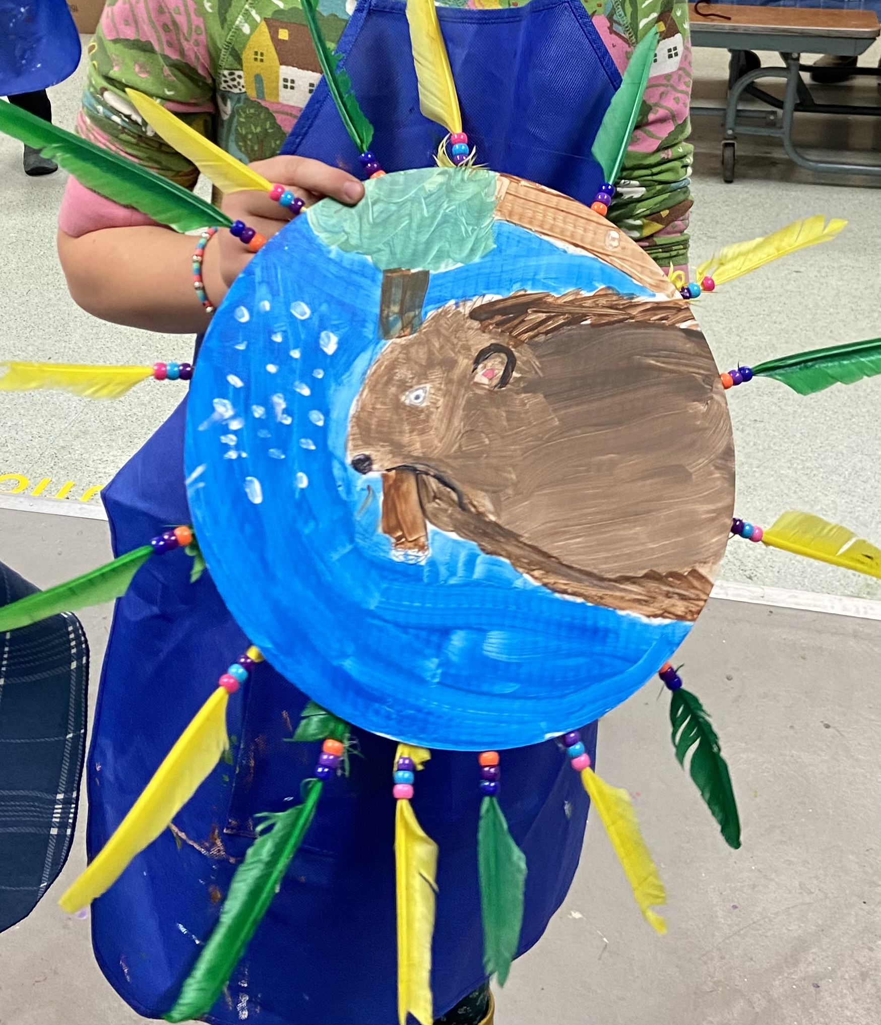 Her power shield of the beaver moving the newly fallen tree across the water